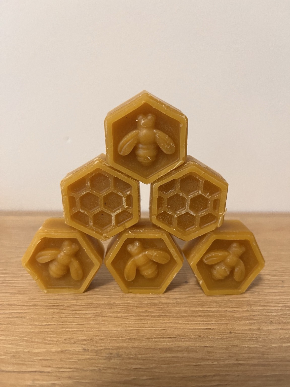 Six Florabella beeswax melts with bee and honeycomb motifs