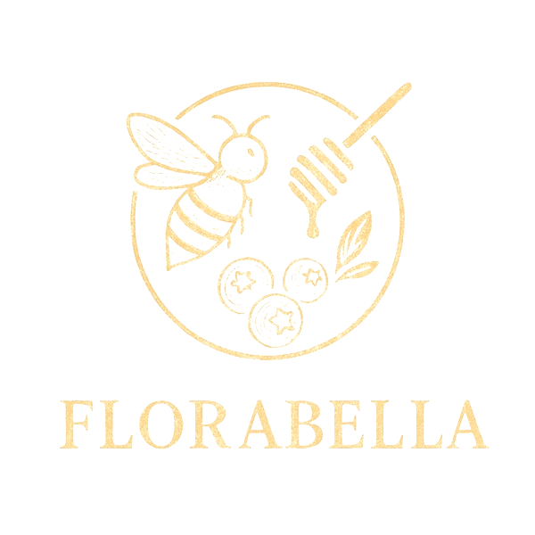 Florabella — engraved gold emblem with a bee, honey dipper and berries